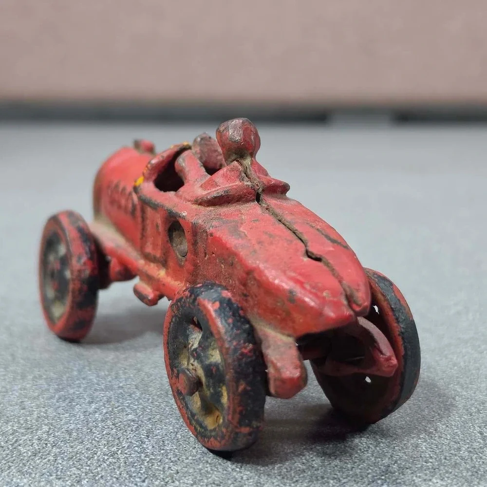 Antique Hubley Cast Iron Boat-tail Race Car Toy Driver 1920's.